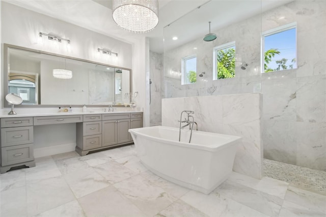 2604 S Bryant Cir, Tampa, FL 33629 - full bath featuring a marble finish shower, marble tiled floors, a freestanding bath, vanity, and a chandelier