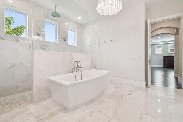 2604 S Bryant Cir, Tampa, FL 33629 - full bathroom with a marble finish shower, a freestanding bath, marble tiled floors, a chandelier, and recessed lighting