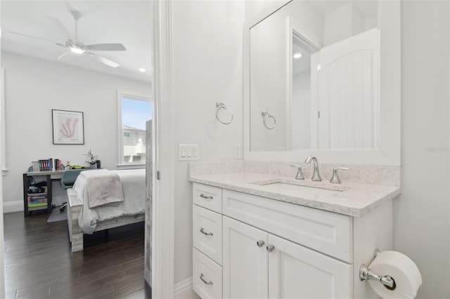 2604 S Bryant Cir, Tampa, FL 33629 - ensuite bathroom with ceiling fan, baseboards, wood finished floors, and vanity