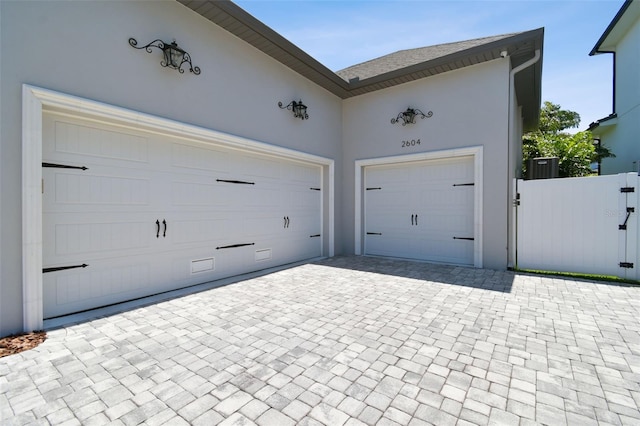 2604 S Bryant Cir, Tampa, FL 33629 - garage with decorative driveway and a gate