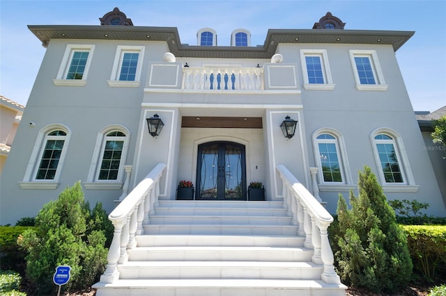 2604 S Bryant Cir, Tampa, FL 33629 - view of front of property with a balcony, french doors, and stucco siding