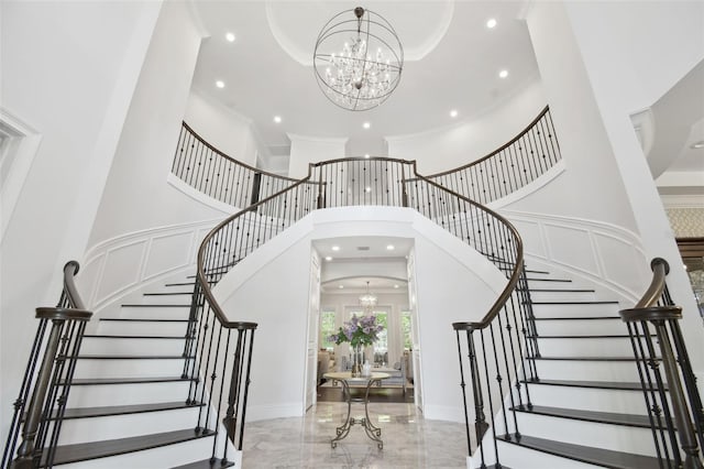 2604 S Bryant Cir, Tampa, FL 33629 - entrance foyer with a chandelier, a towering ceiling, stairway, recessed lighting, and marble tiled flooring