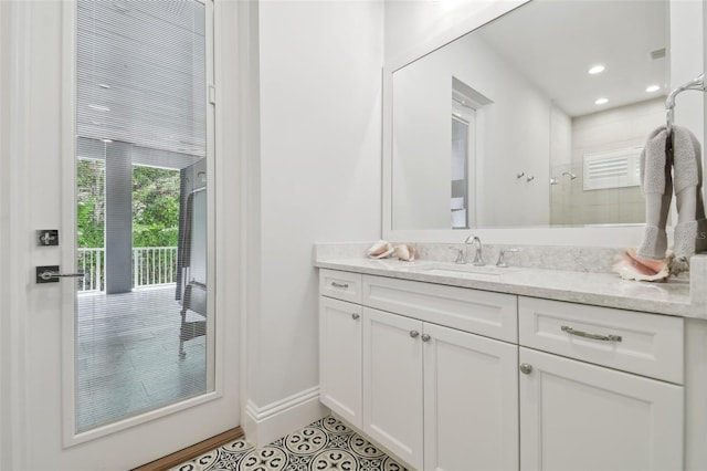 2604 S Bryant Cir, Tampa, FL 33629 - full bath with tiled shower, vanity, baseboards, tile patterned flooring, and recessed lighting