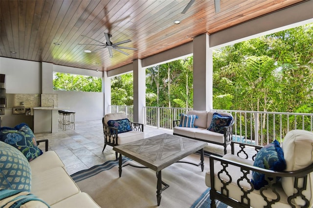 2604 S Bryant Cir, Tampa, FL 33629 - sunroom / solarium featuring an outdoor hangout area, a ceiling fan, and an outdoor kitchen