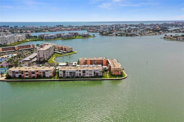 drone / aerial view featuring a view of city and a water view