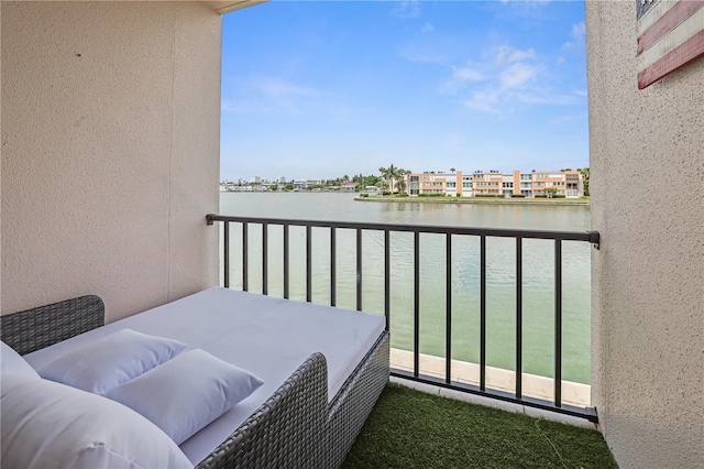 balcony featuring a water view