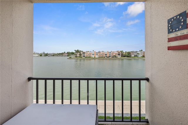 balcony featuring a water view