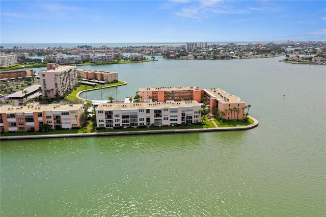 birds eye view of property featuring a city view and a water view