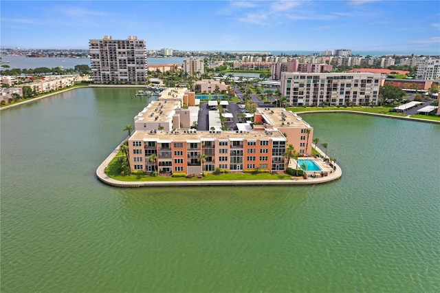birds eye view of property with a view of city and a water view