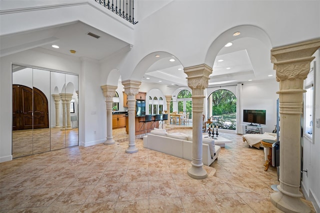1966 Freedom Dr, Clearwater, FL 33755 - entryway featuring decorative columns, a high ceiling, recessed lighting, arched walkways, and baseboards