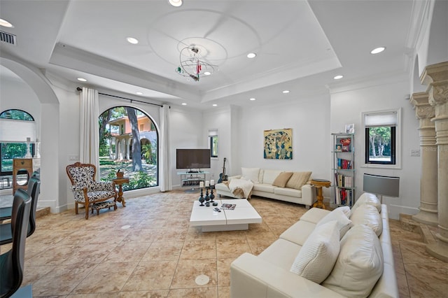 1966 Freedom Dr, Clearwater, FL 33755 - living area featuring a tray ceiling, arched walkways, recessed lighting, crown molding, and light tile patterned flooring