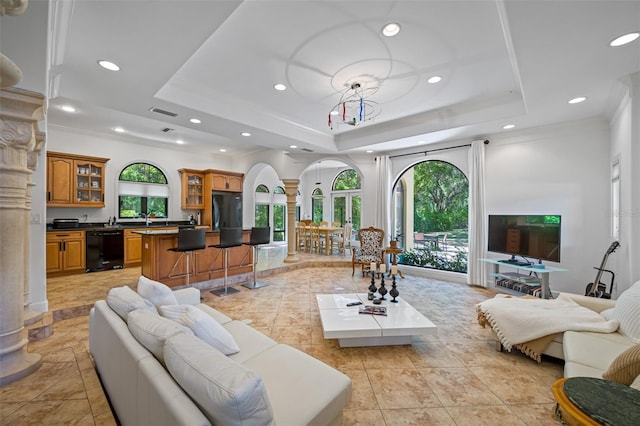 1966 Freedom Dr, Clearwater, FL 33755 - living room with decorative columns, a tray ceiling, and recessed lighting