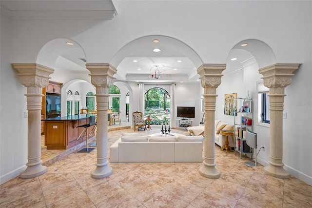 1966 Freedom Dr, Clearwater, FL 33755 - living room with decorative columns, crown molding, baseboards, recessed lighting, and arched walkways