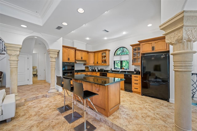 1966 Freedom Dr, Clearwater, FL 33755 - kitchen featuring black appliances, decorative columns, crown molding, arched walkways, and brown cabinetry
