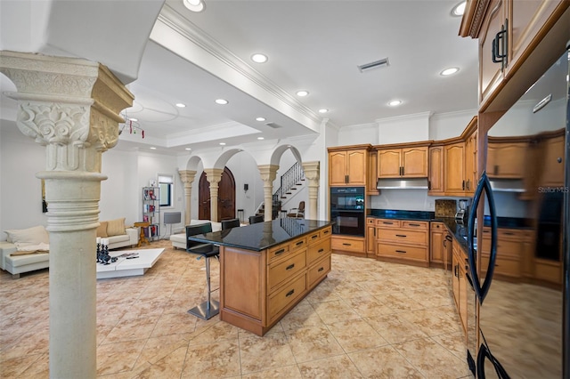 1966 Freedom Dr, Clearwater, FL 33755 - kitchen featuring decorative columns, ornamental molding, black appliances, under cabinet range hood, and open floor plan