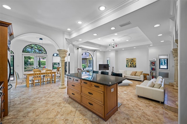 1966 Freedom Dr, Clearwater, FL 33755 - kitchen featuring ornate columns, arched walkways, crown molding, recessed lighting, and brown cabinets