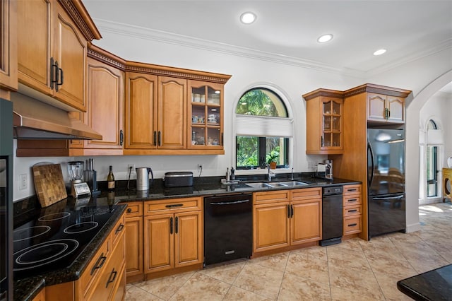 1966 Freedom Dr, Clearwater, FL 33755 - kitchen featuring black appliances, arched walkways, brown cabinets, a sink, and glass insert cabinets