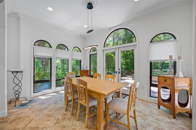 1966 Freedom Dr, Clearwater, FL 33755 - dining space featuring crown molding, french doors, baseboards, recessed lighting, and light tile patterned floors