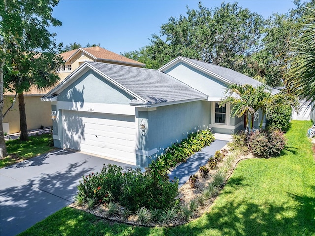 11932 Whisper Creek Dr, Riverview, FL 33569 - single story home with a garage, concrete driveway, stucco siding, a front lawn, and roof with shingles