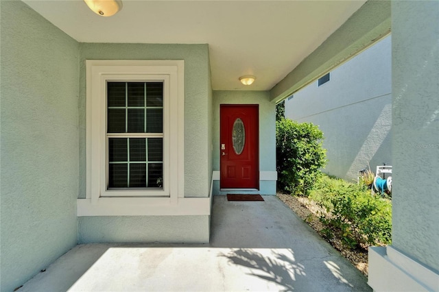 11932 Whisper Creek Dr, Riverview, FL 33569 - doorway to property featuring stucco siding