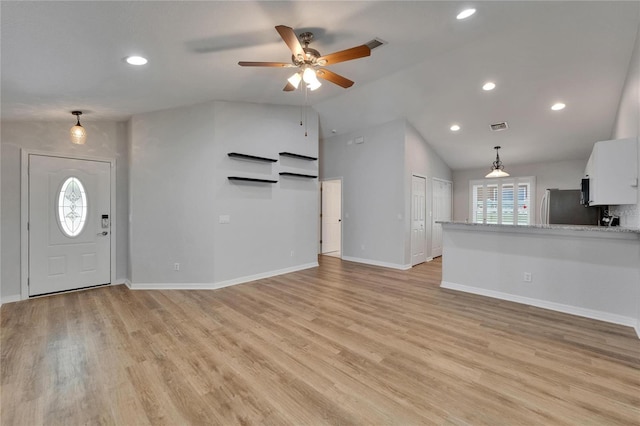 11932 Whisper Creek Dr, Riverview, FL 33569 - unfurnished living room with ceiling fan, vaulted ceiling, baseboards, light wood-style flooring, and recessed lighting