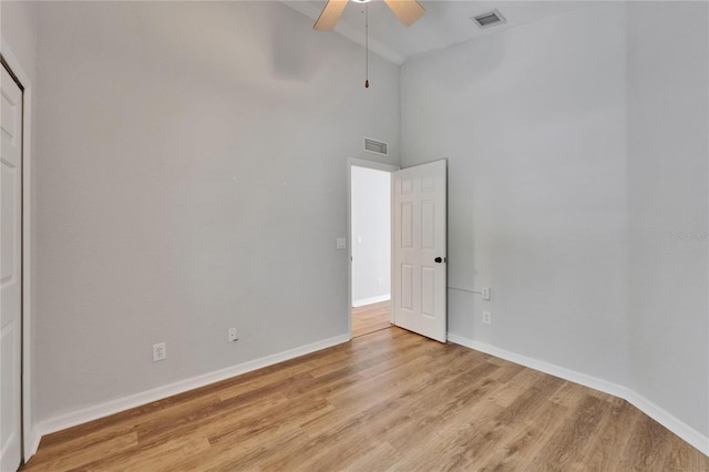 11932 Whisper Creek Dr, Riverview, FL 33569 - unfurnished bedroom featuring light wood-style flooring, baseboards, high vaulted ceiling, and ceiling fan