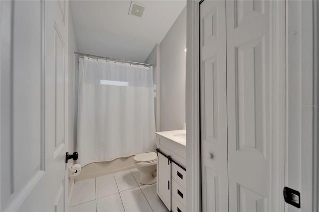 11932 Whisper Creek Dr, Riverview, FL 33569 - bathroom featuring tile patterned floors, vanity, toilet, shower / bath combo with shower curtain, and a closet