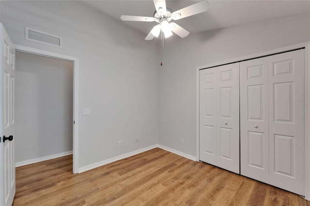 11932 Whisper Creek Dr, Riverview, FL 33569 - unfurnished bedroom featuring light wood-style flooring, baseboards, a closet, and ceiling fan
