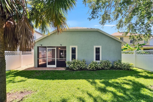 11932 Whisper Creek Dr, Riverview, FL 33569 - back of property featuring stucco siding and a sunroom