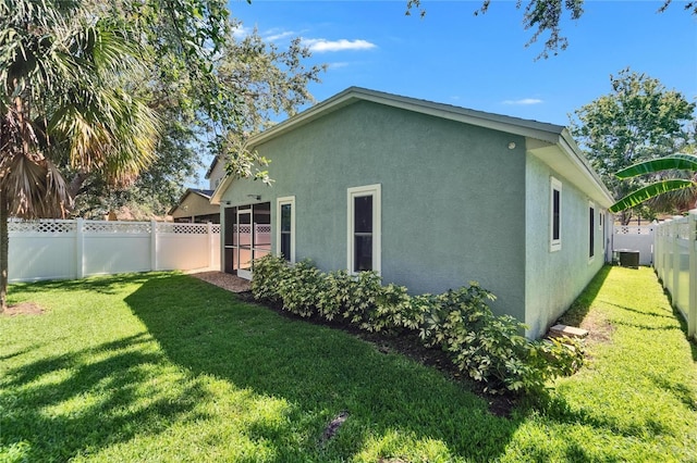11932 Whisper Creek Dr, Riverview, FL 33569 - view of property exterior with stucco siding and central AC unit