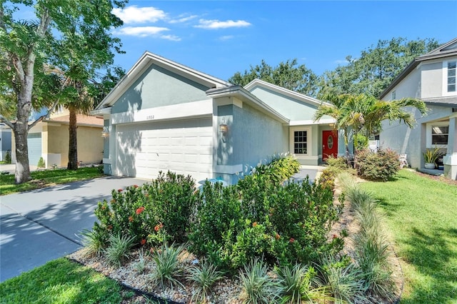 11932 Whisper Creek Dr, Riverview, FL 33569 - single story home featuring an attached garage, driveway, stucco siding, and a front lawn