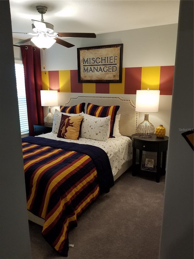 bedroom with ceiling fan and carpet flooring