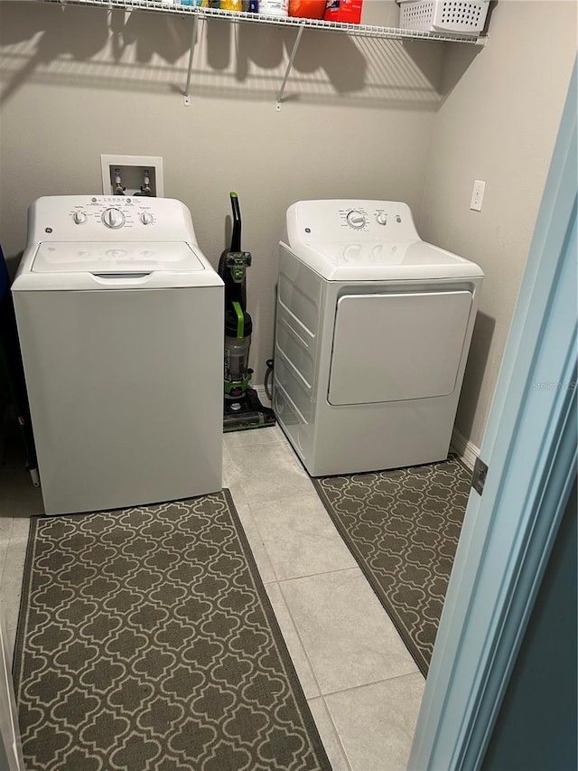 washroom featuring independent washer and dryer and laundry area