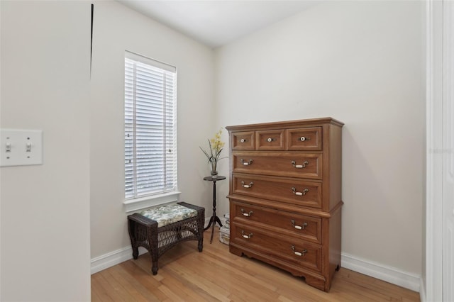 interior space featuring wood finished floors and baseboards