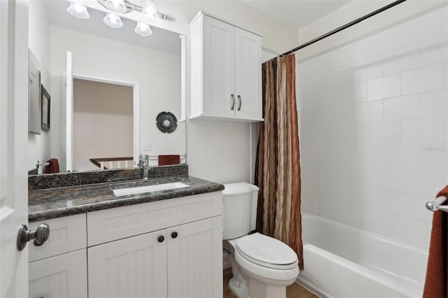 bathroom with toilet, shower / bathtub combination with curtain, and vanity