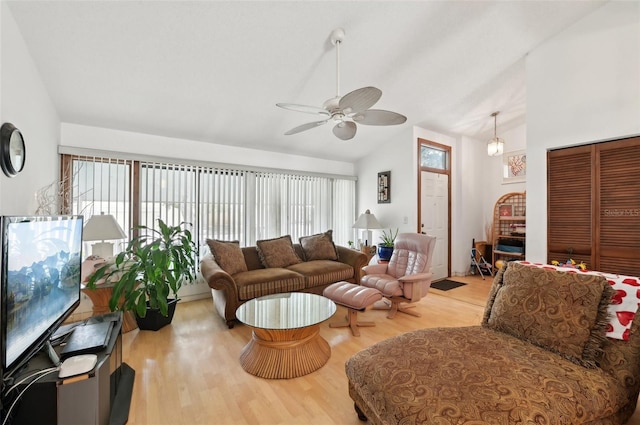 3093 Woodpine Cir, Sarasota, FL 34231 - living room with ceiling fan, light wood finished floors, and lofted ceiling