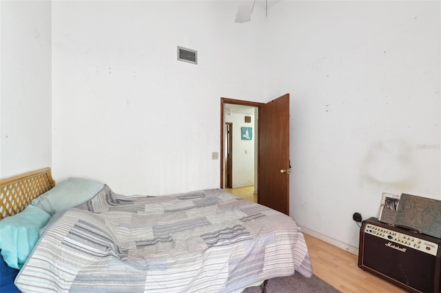3093 Woodpine Cir, Sarasota, FL 34231 - bedroom with visible vents and light wood-style flooring