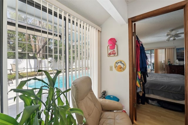 3093 Woodpine Cir, Sarasota, FL 34231 - bedroom featuring a textured ceiling and wood finished floors