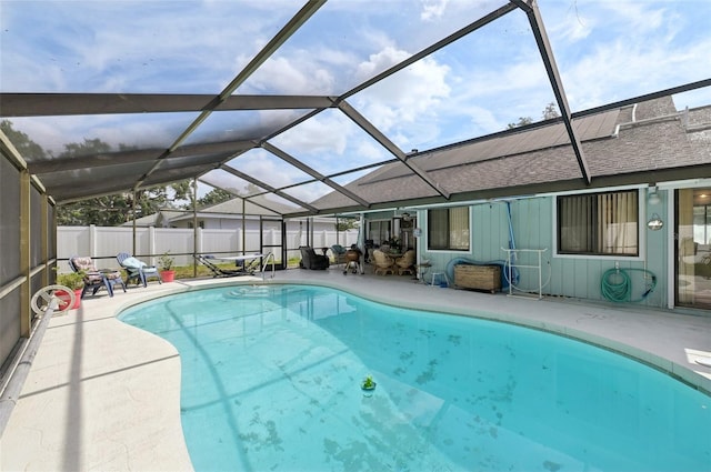 3093 Woodpine Cir, Sarasota, FL 34231 - view of swimming pool with a fenced in pool, glass enclosure, a patio area, and fence