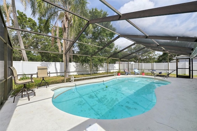 3093 Woodpine Cir, Sarasota, FL 34231 - view of pool featuring a patio, a fenced in pool, a lanai, and a fenced backyard