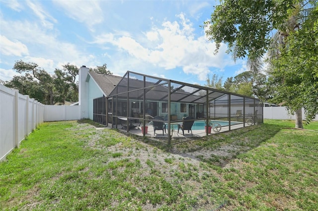 3093 Woodpine Cir, Sarasota, FL 34231 - rear view of house with a yard, a fenced in pool, a fenced backyard, and a patio area