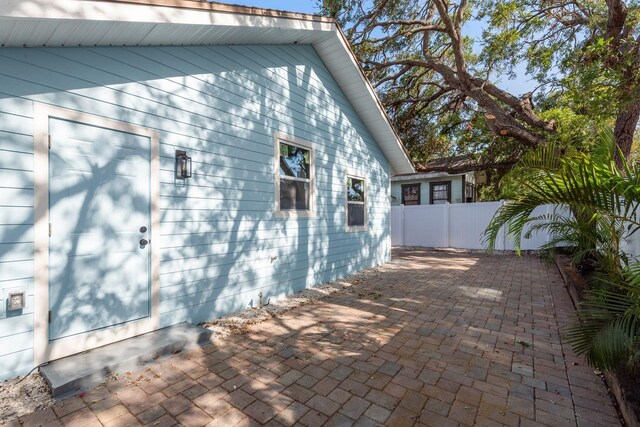 110 Kenwood Ave, Clearwater, FL 33755 - view of property exterior featuring a patio area
