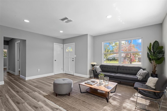 660 Palm Ave, Tarpon Springs, FL 34689 - living area with wood finished floors, visible vents, recessed lighting, and baseboards