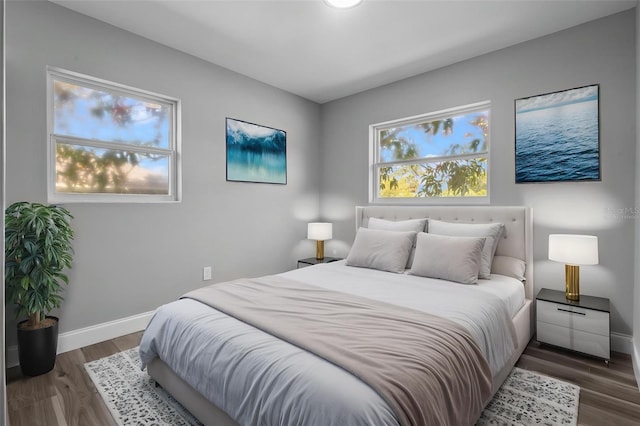 660 Palm Ave, Tarpon Springs, FL 34689 - bedroom with wood finished floors and baseboards