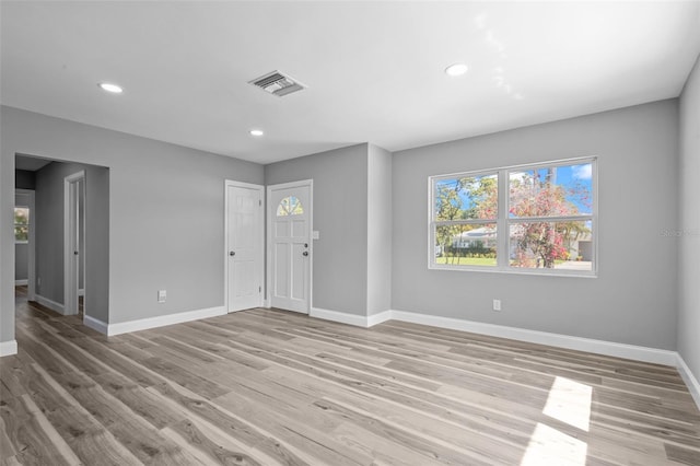 660 Palm Ave, Tarpon Springs, FL 34689 - interior space with visible vents, recessed lighting, light wood-style flooring, and baseboards