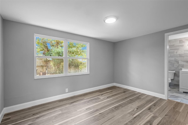 660 Palm Ave, Tarpon Springs, FL 34689 - interior space featuring baseboards and light wood finished floors