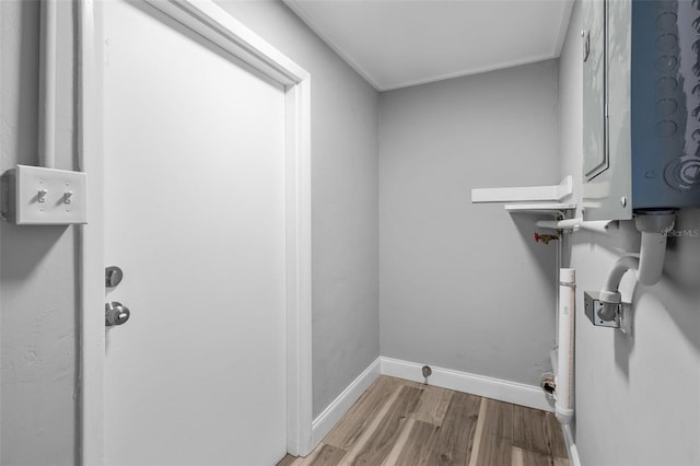 660 Palm Ave, Tarpon Springs, FL 34689 - laundry area with wood finished floors, laundry area, and baseboards