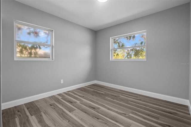 660 Palm Ave, Tarpon Springs, FL 34689 - empty room with wood finished floors and baseboards