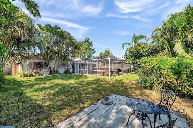 view of yard with a patio and a lanai