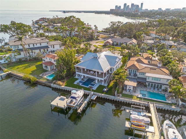 birds eye view of property with a residential view and a water view